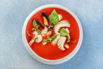 tomato soup with seafood, cold tomato soup or gazpacho, top view. copy space for text