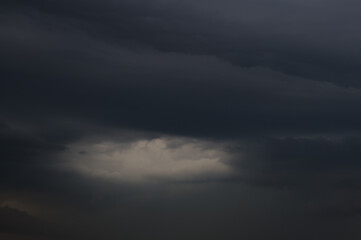 big black clouds in the sky before the rain
