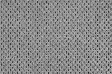 Plain gray velour upholstery fabric, fleecy jacquard with macro, closr up pattern weave texture background, cloth textile surface. Wallpaper, backdrop with copy space