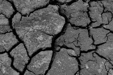Wall texture soil dry crack pattern of drought lack of water of nature brown old broken background.