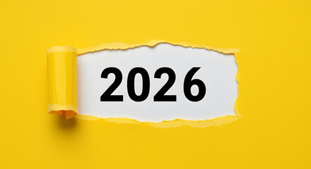 A bright yellow background features a big, white sheet of paper that's being pulled back by revealing the bold, black digits "2026" 