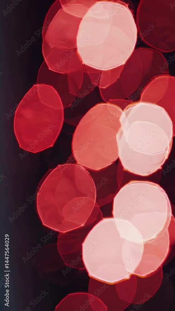 Aufkleber abstract video still with red bokeh lights, captured from a high angle. the blurred circles create a