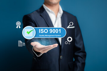 Professional Businessman Displaying ISO 9001 Quality Management Concept