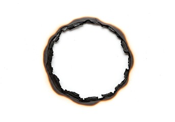 A burnt hole in white paper with charred edges forming a circular shape on a clean background