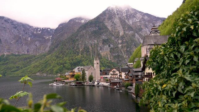  Hallstatt, Austria. Hallstatt is a village on Lake Hallstatt's western shore in Austria's mountainous Salzkammergut region. Region being included in the world heritage list by UNESCO. 