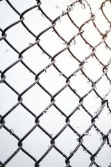 Naklejka premium New chain link fence against a bright white background , photography, outdoors
