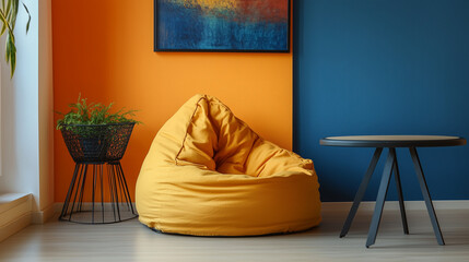 The colorful wall with a picture has a beanbag and table arranged beside it.