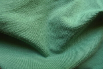 simple unprinted juniper green cotton fabric in soft folds
