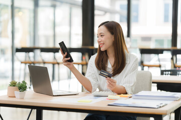 Woman Shopping Online with Smartphone and Credit Card