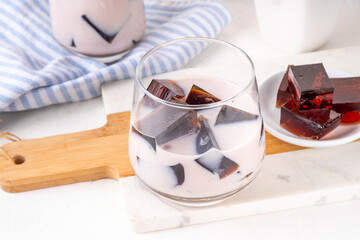 Homemade milky tea jelly, cold summer drink with black tea jelly and tea milk. Thai style iced cocktail, copy space