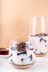 Homemade milky tea jelly, cold summer drink with black tea jelly and tea milk. Thai style iced cocktail, copy space