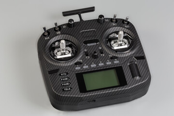 Radio remote control with screen display on a gray background