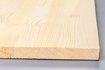 Сorner of wooden panel made of softwood planks close-up