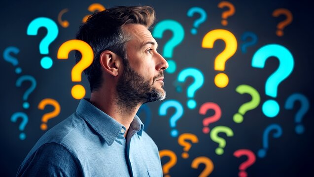 Contemplative man gazing at floating question marks