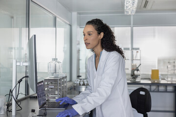 Woman scientist immersed in digital analysis in 