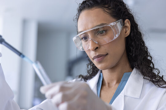 Scientist focused on precise liquid measurement