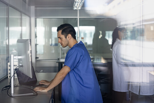 Medical Professional Concentrated on Computer Work