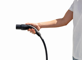Isolated EV charging connector in hand of female person
