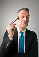 thoughtful man with a key in his hand