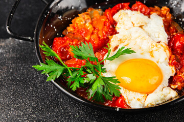 Fried egg tomatoes shakshuka vegetable dish appetizer fresh delicious gourmet food background on the table rustic food top view copy space vegetarian  food