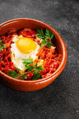 Fried egg tomatoes shakshuka vegetable dish appetizer fresh delicious gourmet food background on the table rustic food top view copy space vegetarian  food