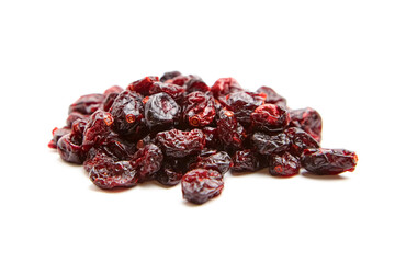 Close-up of a shiny pile of dried cranberries with a rich red color and wrinkled texture, presented on a plain white background