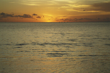 Mesmerizing sunset over ocean horizon in bali - tranquil tropical evening scene