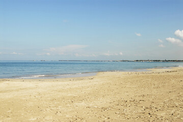 Tranquil beach scene in bali capturing the serene beauty of the sea on a clear day