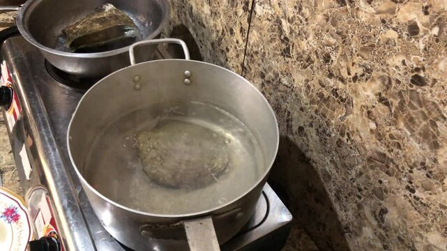Placuna saddle oysters, also known as windowpane or capiz oysters, are soaked in hot boiling water so that the meat falls out on its own