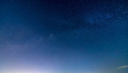 Obraz premium Stunning night sky filled with countless stars, creating a beautiful cosmic backdrop. Perfect for backgrounds, websites, or any project needing a celestial feel.