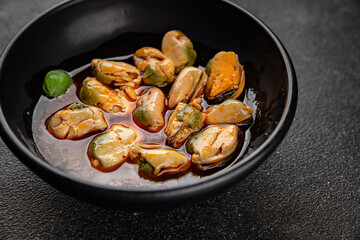 Mussels canned seafood appetizer dish organic product fresh tasty gourmet food background on the table rustic food top view copy space keto paleo pescetarian diet vegetarian food