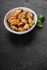 Mussels canned seafood appetizer dish organic product fresh tasty gourmet food background on the table rustic food top view copy space keto paleo pescetarian diet vegetarian food