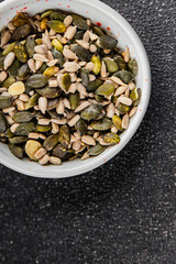 Seed mix pumpkin seeds, sunflower seeds superfood natural food dish organic fresh tasty gourmet food background on the table rustic food top view copy space vegetarian vegan food keto paleo diet