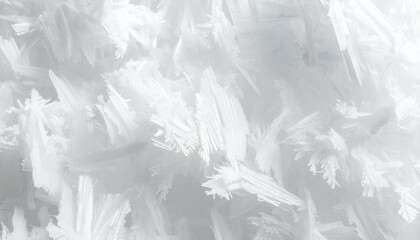 Close-up of delicate, white ice crystals; a pristine winter texture. Ideal for backgrounds, websites, and design projects.