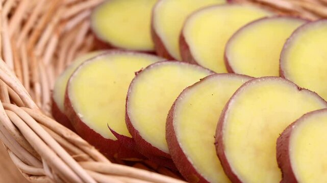 Sliced sweet potatoes in wooden