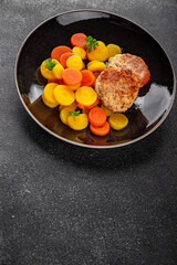 Vegetarian cutlets and boiled carrots in a bowl natural food vegetables dish organic fresh gourmet food background on the table rustic food top view copy space keto paleo diet vegetarian vegan food
