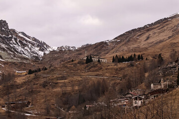 Stunning winter view over the snow-covered Alps in Valle Grana, Cuneo, Piedmont region of northern Italy. A serene alpine landscape with crisp air, mountain peaks, and natural beauty.