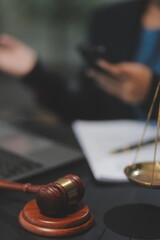 female business woman lawyers working at the law firms. Judge gavel with scales of justice. Legal law, lawyer, documents, advice and justice concept.