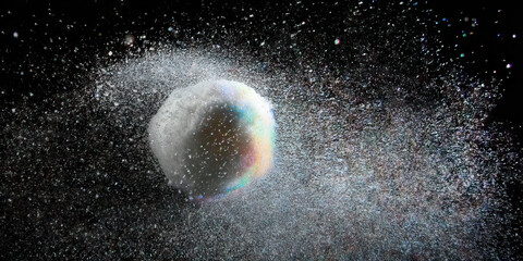 Sphere with Dispersed Particles Against Black Background