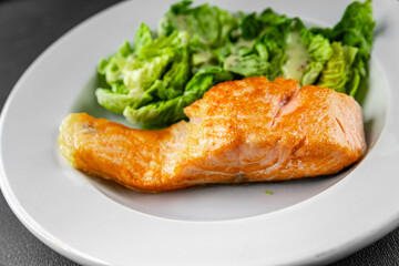 Salmon fried fish seafood dish fresh delicious gourmet food background on the table rustic food top view copy space keto paleo diet vegetarian food pescetarian diet