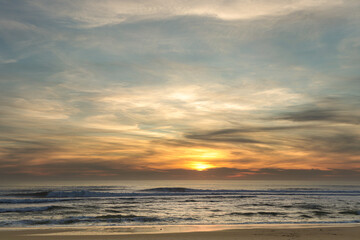 Fototapeta premium Golden sunset over calm ocean