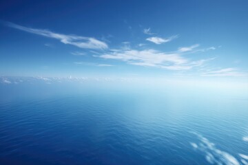 Fototapeta premium aerial view of vast serene ocean with gentle waves showcasing endless blue horizon and sky above