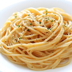A delicious plate of perfectly cooked spaghetti aglio e olio is garnished with fresh parsley and black pepper.
