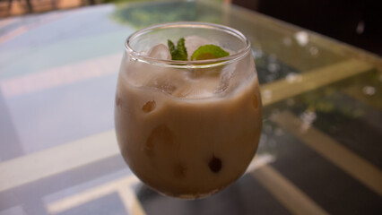 Iced Milk Coffee in a Clear Glass – Refreshing Café Beverage