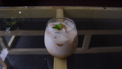 Iced Milk Coffee in a Clear Glass – Refreshing Café Beverage