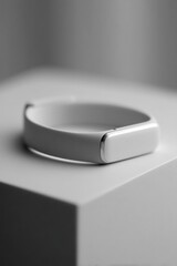 sleek fitness gadget resting on pristine surface shows advanced technology poised for modern lifestyles