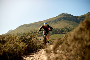 Nature, fitness and man cycling on dirt road for gravel race, challenge or competition training....