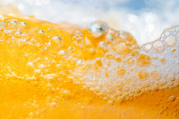 Close up bright orange Oil or beer splash texture and nature waves, Beautiful waves curve and...