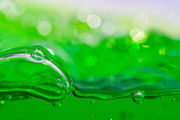 Water wave, close up of vibrant green liquid with bubbles, capturing dynamic movement and...