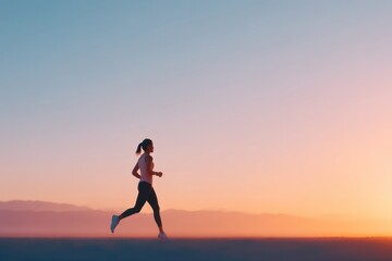 runner silhouette against sunrise sky highlighting early morning fitness with expansive copy space